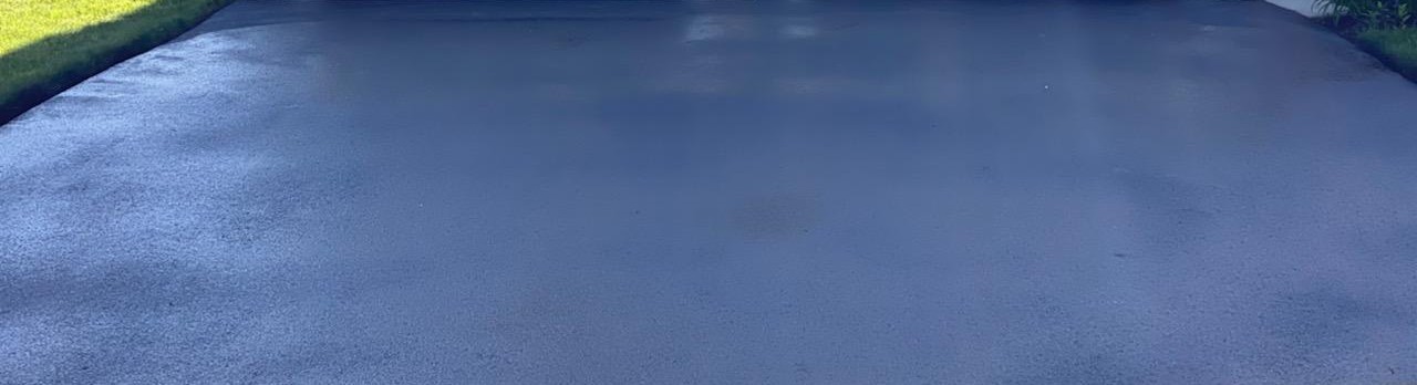 Detail of freshly seal-coated driveway.